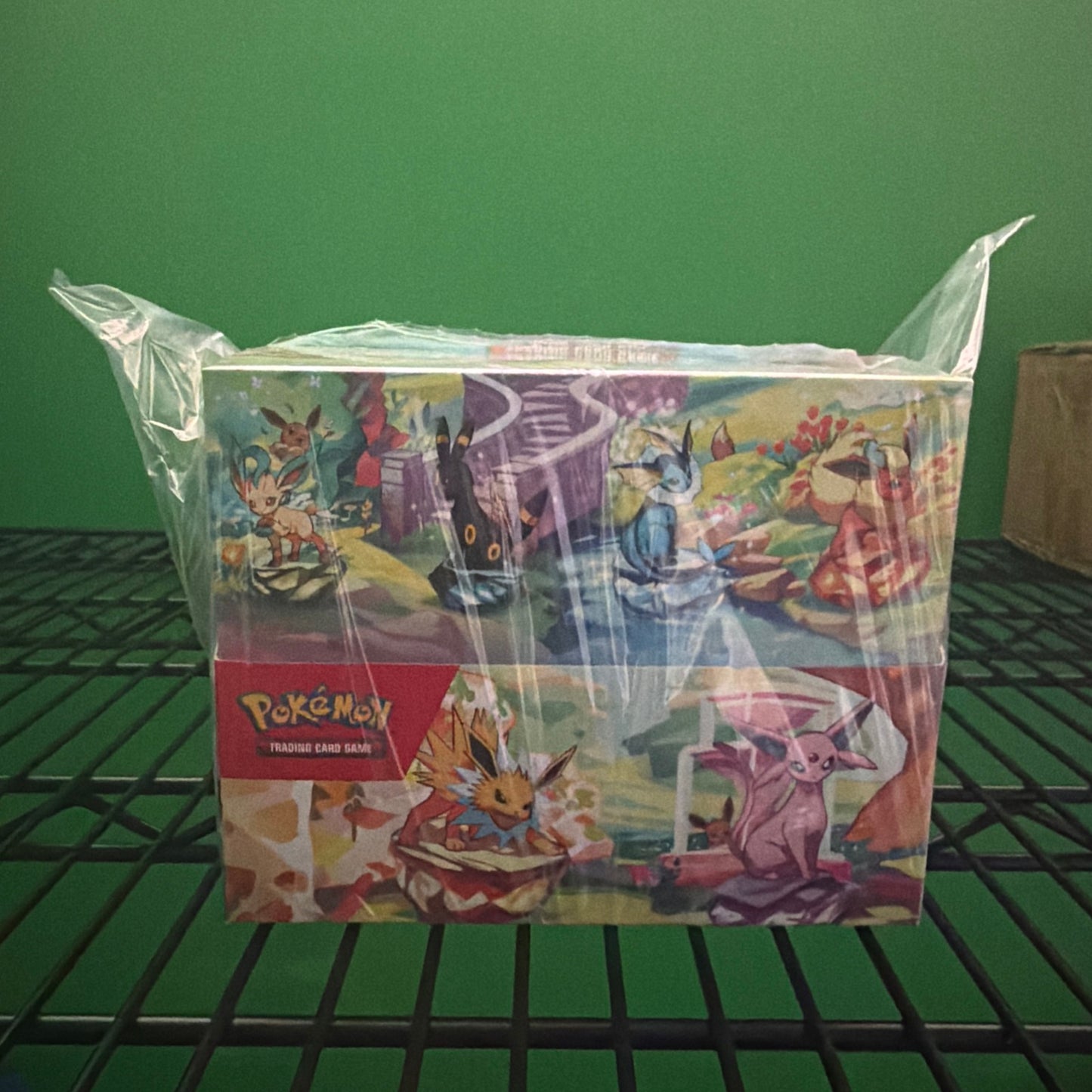 Pokémon sealed Tin display: prismatic evolution
